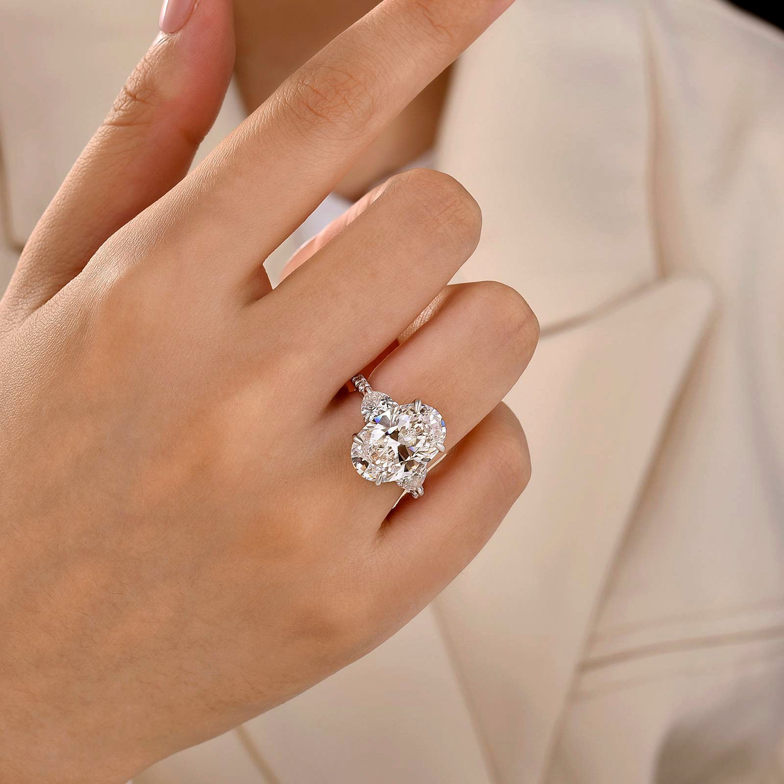 7.0Ct Oval Cut Three-Stone Engagement Ring with Heart Side Stones