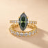 Green marquise engagement ring with matching wedding band