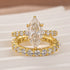 Yellow gold marquise moissanite engagement ring and band