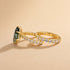 Side view of yellow gold green marquise engagement ring
