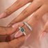 Round green moissanite engagement ring set close-up