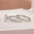 Side view of white gold oval moissanite wedding ring set