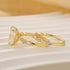 Yellow gold radiant cut ring set side view