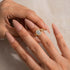 Yellow gold plated moissanite halo ring on hand