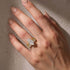 Marquise engagement ring with two eternity bands on hand