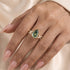 Nature-inspired green moissanite ring worn on hand