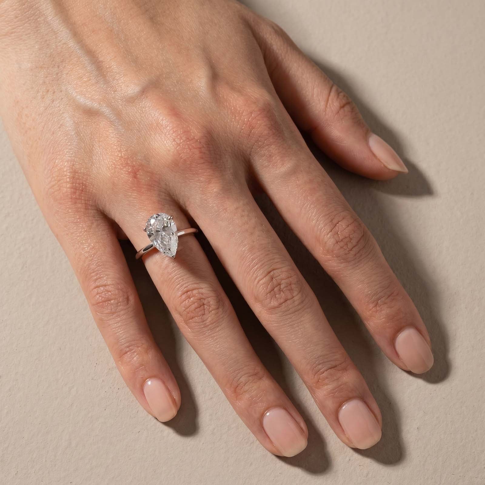 S925 4.0Ct Pear Cut Hidden Halo Simulated Diamond Engagement Ring in Sterling Silver