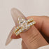 Close-up of marquise moissanite ring with side stones