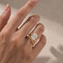 Cushion cut bypass engagement ring close-up