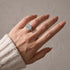 Split shank cushion cut engagement ring worn on hand