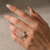 Yellow gold plated oval engagement ring on hand