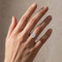 Radiant cut moissanite wedding ring set on woman’s hand