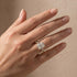 Woman wearing a yellow gold radiant cut wedding ring set
