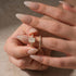 Woman holding a radiant cut moissanite wedding ring set