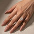 Marquise hidden halo engagement ring worn on hand