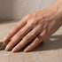 Yellow gold radiant moissanite ring worn on hand