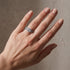 Round cut engagement ring with two matching bands