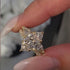 Close-up of marquise engagement ring and insert band
