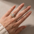 Three-piece oval wedding ring set worn on hand