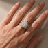 White gold radiant cut wedding ring set worn in natural light