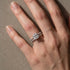 Cushion cut engagement ring and matching band on hand