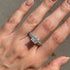 Stackable princess cut bridal ring set on woman’s hand