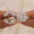 White gold radiant cut wedding ring set held between fingers