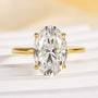 Close-up of yellow gold oval cut solitaire engagement ring