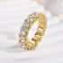 Angled view of yellow gold round cut eternity band