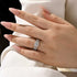 Round cut wedding ring set stacked on hand
