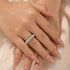 Round cut eternity ring styled as a stackable wedding band