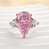 Pink pear cut three stone engagement ring front view