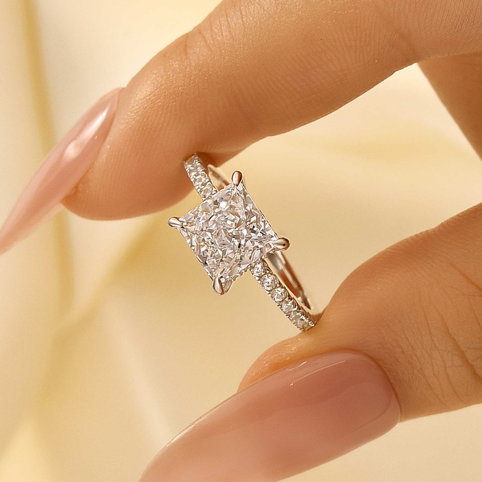 2Ct Princess Cut Engagement Ring Held Between Fingers