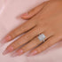 Radiant cut halo engagement ring worn on hand