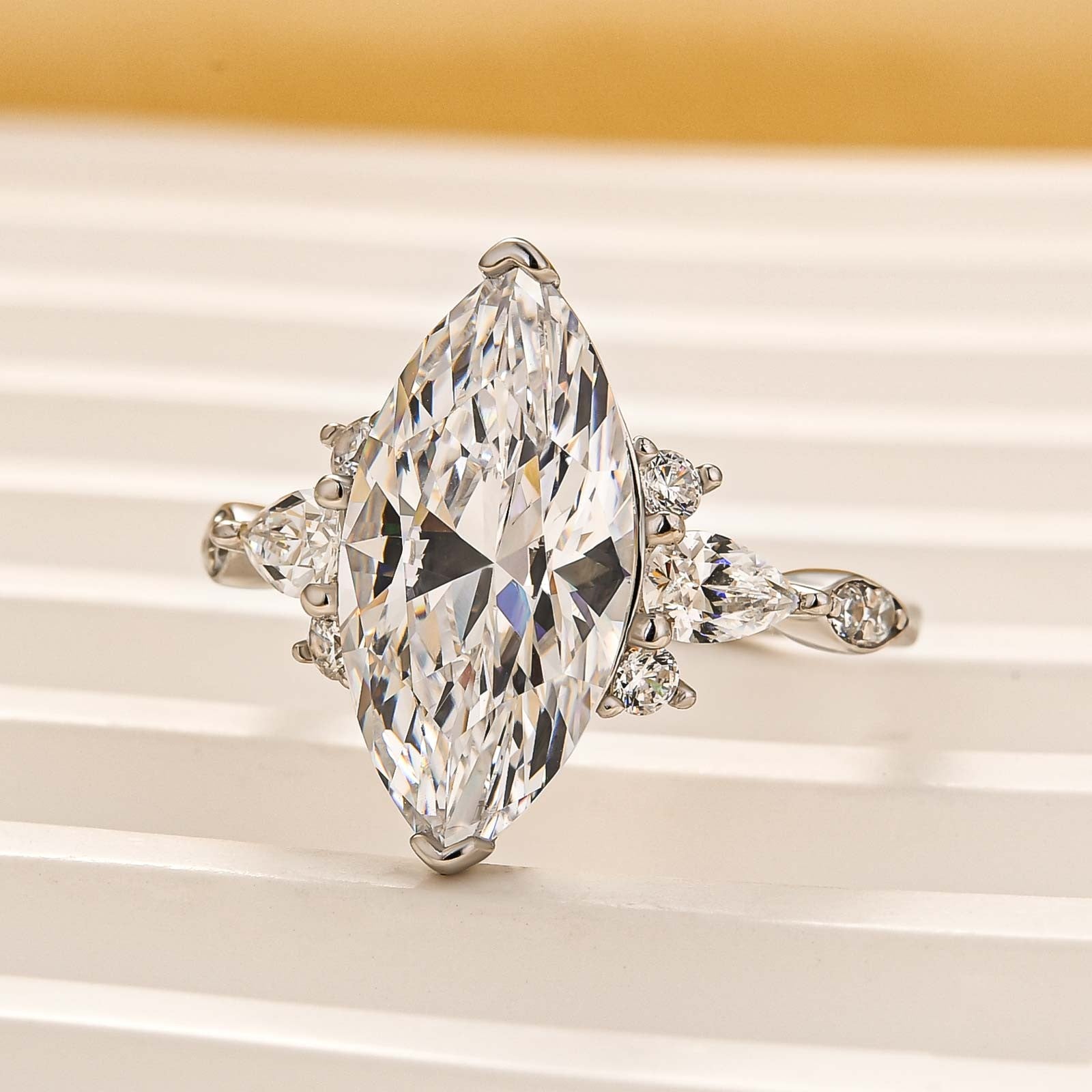 4.0Ct Marquise Cut White Stone with Round & Marquise Cut Side Stone Engagement Rings