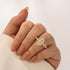 Yellow gold marquise moissanite wedding set worn on hand