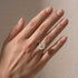 Yellow gold hidden halo oval promise ring worn on hand