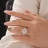 Three stone cushion engagement ring hand view