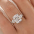 Close-up of cushion cut moissanite ring with heart side stones
