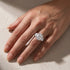 Three-stone cushion cut travel ring styled for everyday wear