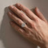 Radiant Cut Three-Stone Engagement Ring Worn on Hand