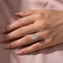 Woman styling a 3.5Ct oval cut engagement ring