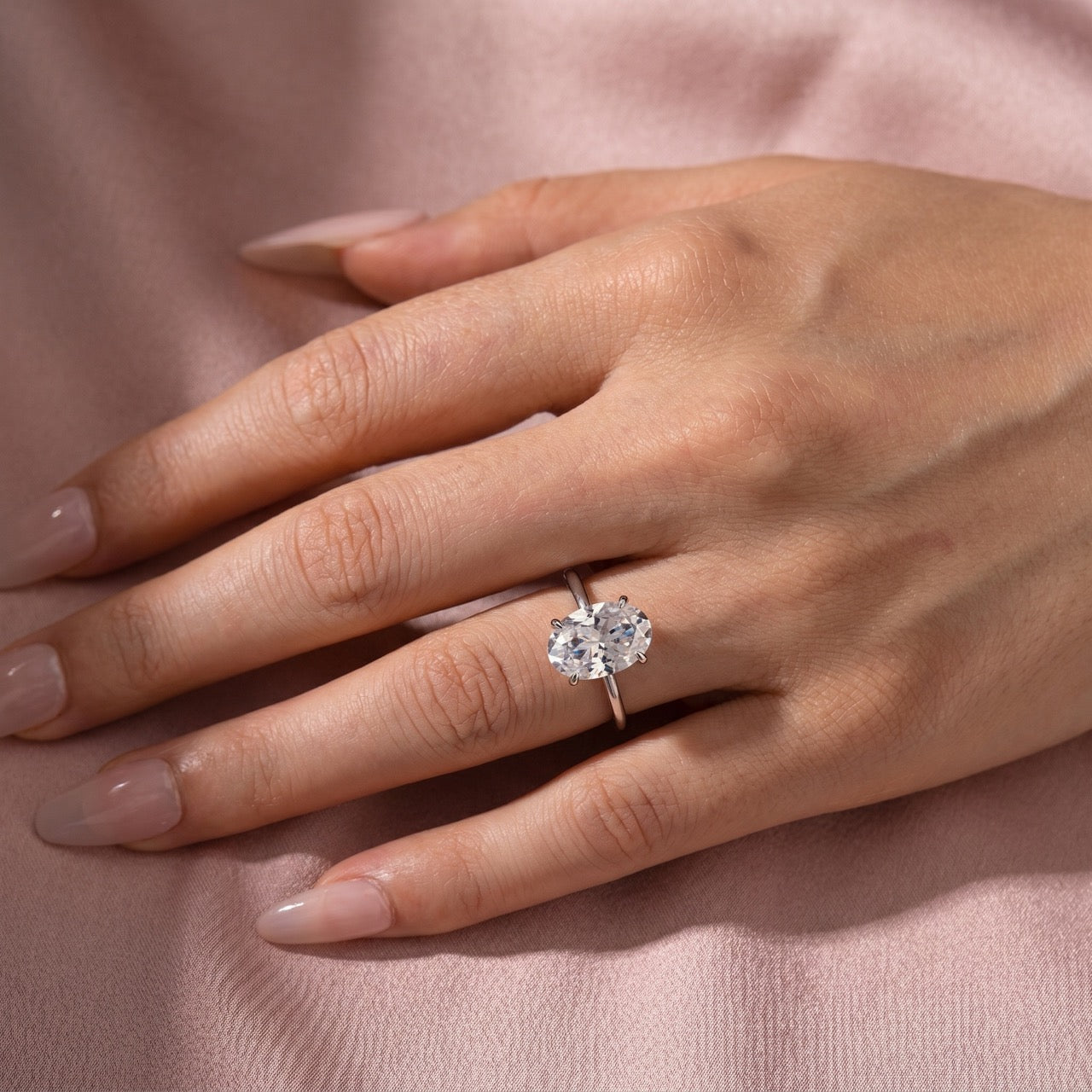 Woman styling a 3.5Ct oval cut engagement ring