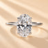Yellow gold oval cut engagement ring displayed in soft natural light