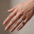 Oval cut engagement ring worn on an elegantly posed hand