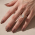 Yellow gold oval engagement ring shown during everyday wear
