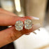 Cushion Cut Stud Earring Pair Held in Hand