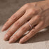 Silver marquise stackable wedding band on hand