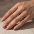 Woman wearing a silver marquise wedding band