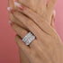 Silver cushion cut four-piece wedding ring stack on hand